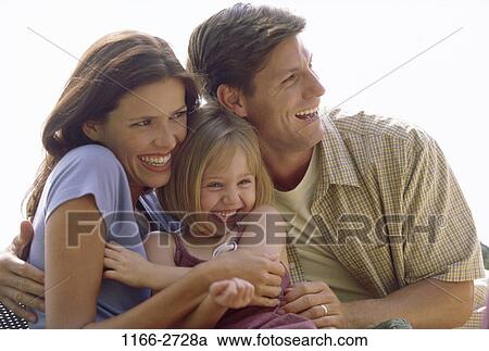 people, smiling, excitement, laughing, outdoors, hugging, family View Large Photo Image Stock Image - people, smiling, excitement, laughing, outdoors, hugging, family. Fotosearch