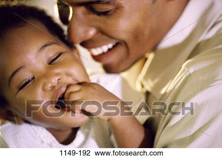 people, smiling, happy, toddler, playful, nurturing, contemplation View Large Photo Image Stock Image - people, smiling, happy, toddler, playful, nurturing, contemplation. Fotosearch