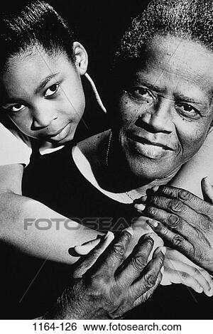 Stock Photograph - people, smiling, hugging, smile, family, embracing, embrace. Fotosearch
