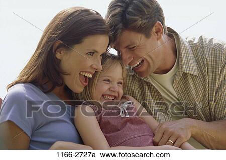 people, smiling, laughing, playful, outdoors, nurturing, hugging View Large Photo Image Stock Image - people, smiling, laughing, playful, outdoors, nurturing, hugging. Fotosearch