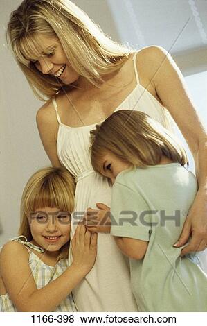 people, smiling, listening, mother, hugging, smile, family View Large Photo Image Stock Photo - people, smiling, listening, mother, hugging, smile, family. Fotosearch