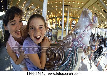 people, smiling, mother, happy, riding, outdoors, park View Large Photo Image Stock Image - people, smiling, mother, happy, riding, outdoors, park. Fotosearch