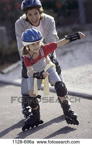 Stock Image - people, smiling, mother, outdoors, pulling, smile, family. Fotosearch