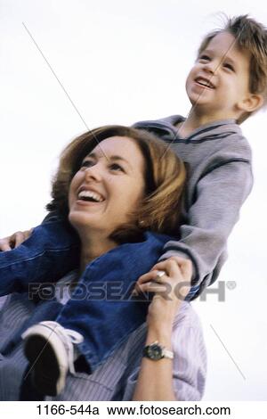 people, smiling, mother, riding, outdoors, carrying, family View Large Photo Image Stock Image - people, smiling, mother, riding, outdoors, carrying, family. Fotosearch