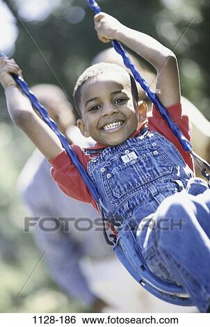 people, smiling, playing, happy, swinging, holding, swing View Large Photo Image Stock Photograph - people, smiling, playing, happy, swinging, holding, swing. Fotosearch