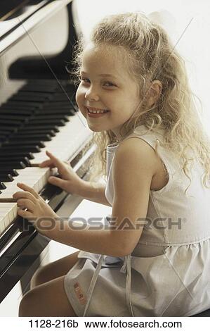people, smiling, playing, sitting, music, girl, piano View Large Photo Image Stock Image - people, smiling, playing, sitting, music, girl, piano. Fotosearch