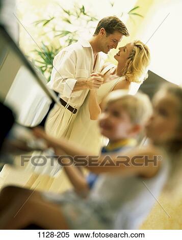Stock Photography - people, smiling, playing, sitting, mother, dancing, piano. Fotosearch