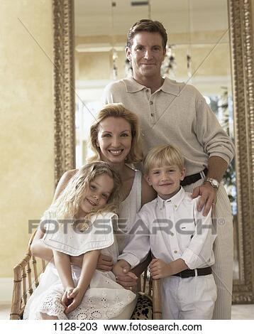 Stock Image - people, smiling, sitting, holding, mirror, smile, family. Fotosearch