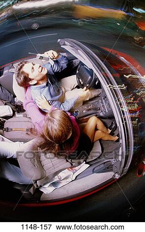 people, smiling, talking, couple, phone, driving, convertible View Large Photo Image Stock Photo - people, smiling, talking, couple, phone, driving, convertible. Fotosearch