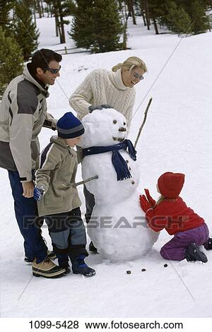 people, snow, building, playing, winter, sunglasses, outdoors View Large Photo Image Stock Photo - people, snow, building, playing, winter, sunglasses, outdoors. Fotosearch