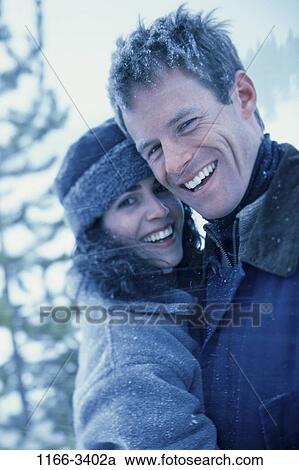 people, snow, couple, winter, outdoors, weather, Middle-aged View Large Photo Image Stock Image - people, snow, couple, winter, outdoors, weather, Middle-aged. Fotosearch