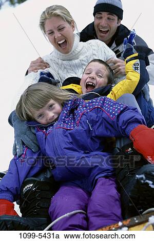 people, snow, playing, winter, laughing, hill, outdoors View Large Photo Image Stock Image - people, snow, playing, winter, laughing, hill, outdoors. Fotosearch