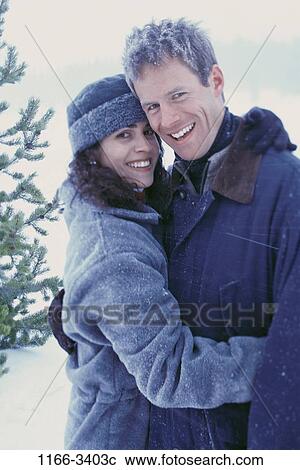 people, snow, smiling, couple, winter, cold, outdoors View Large Photo Image Stock Image - people, snow, smiling, couple, winter, cold, outdoors. Fotosearch