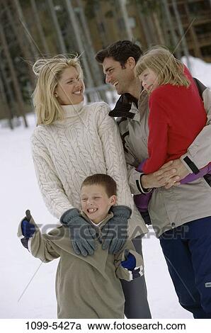 people, snow, smiling, winter, holding, gesturing, standing View Large Photo Image Stock Image - people, snow, smiling, winter, holding, gesturing, standing. Fotosearch