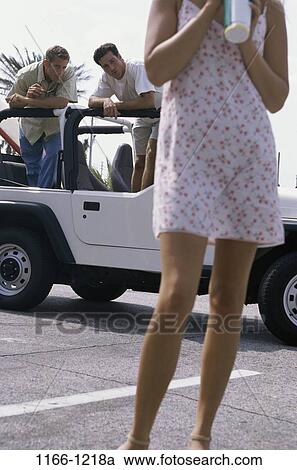 Stock Image - people, staring, car, flirting, outdoors, transportation, looking. Fotosearch