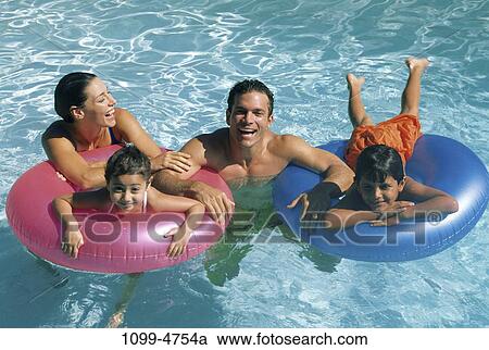people, swim, floating, water, pool, playing, swimming View Large Photo Image Stock Image - people, swim, floating, water, pool, playing, swimming. Fotosearch