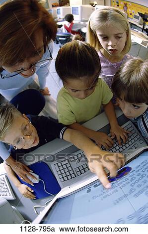 people, teacher, technology, school, computer, classroom, pointing View Large Photo Image Stock Image - people, teacher, technology, school, computer, classroom, pointing. Fotosearch