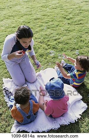 Stock Image - people, teenager, babysitting, babysit, Teenagers babysitting children. Fotosearch