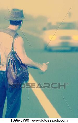 Stock Image - people, thumb, hat, road, car, backpack. Fotosearch