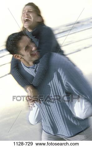 people, walking, couple, beach, laughing, outdoors, carrying View Large Photo Image Stock Photo - people, walking, couple, beach, laughing, outdoors, carrying. Fotosearch