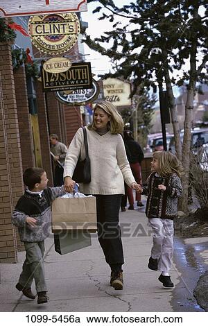 people, walking, mother, street, outdoors, shopping, family View Large Photo Image Stock Image - people, walking, mother, street, outdoors, shopping, family. Fotosearch