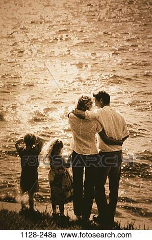 people, water, beach, outdoors, contemplation, unity, family View Large Photo Image Stock Image - people, water, beach, outdoors, contemplation, unity, family. Fotosearch