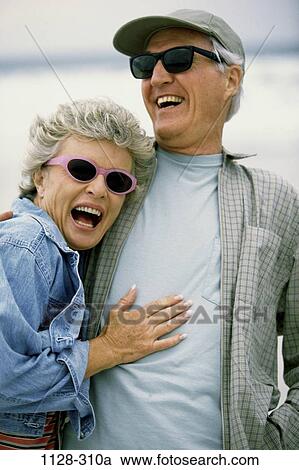 people, water, couple, senior, beach, laughing, sunglasses View Large Photo Image Stock Image - people, water, couple, senior, beach, laughing, sunglasses. Fotosearch