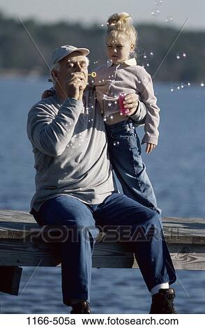 Stock Image - people, water, hat, bubbles, lake, outdoors, dock. Fotosearch
