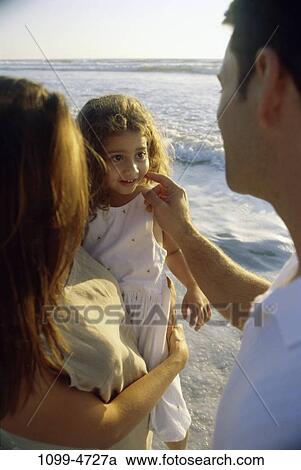 Stock Image - people, water, Hispanic, beach, holding, family, touching. Fotosearch