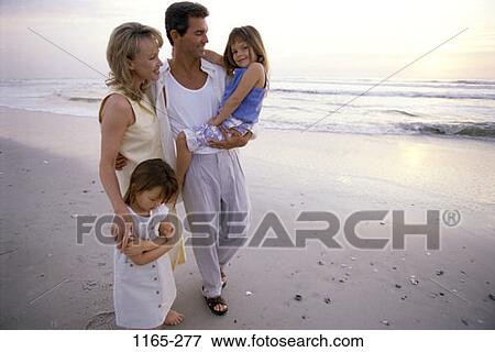 Stock Photo - people, water, smiling, walking, beach, holding, shore. Fotosearch