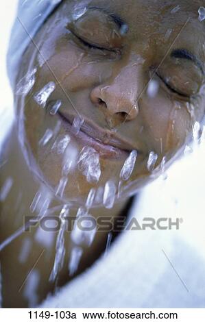 Stock Image - people, water, woman, face, splash, relaxing, washing. Fotosearch