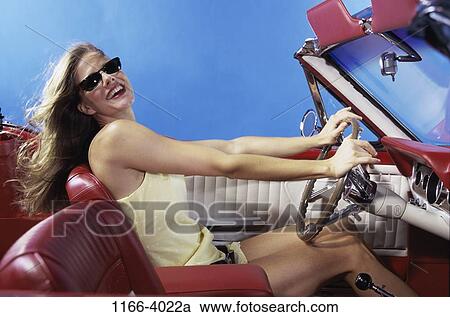 people, woman, car, driving, convertible, sunglasses, outdoors View Large Photo Image Stock Image - people, woman, car, driving, convertible, sunglasses, outdoors. Fotosearch