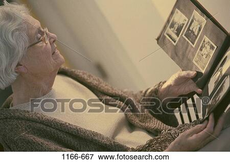 Stock Photo - people, woman, eyeglasses, senior, looking, lonely, sepia. Fotosearch