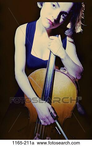 people, woman, music, arts, entertainment, Middle-aged, contemplation View Large Photo Image Stock Image - people, woman, music, arts, entertainment, Middle-aged, contemplation. Fotosearch
