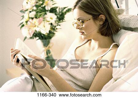 people, woman, profile, eyeglasses, reading, bed, book View Large Photo Image Stock Image - people, woman, profile, eyeglasses, reading, bed, book. Fotosearch