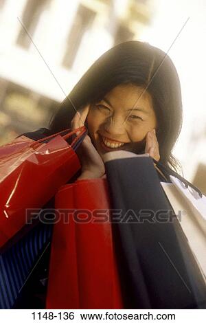 people, woman, smiling, Asian, excited, outdoors, shopping View Large Photo Image Stock Photograph - people, woman, smiling, Asian, excited, outdoors, shopping. Fotosearch