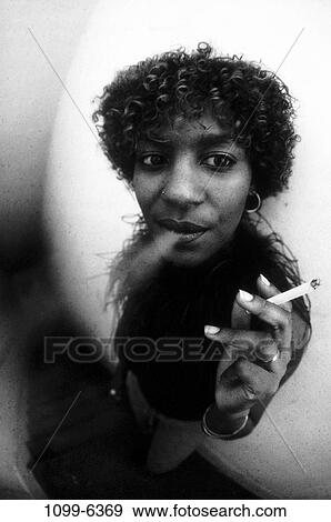 people, woman, smoke, cigarette, outdoors, smoking, black and white View Large Photo Image Stock Photo - people, woman, smoke, cigarette, outdoors, smoking, black and white. Fotosearch