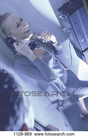 people, woman, telephone, night, talking, couple, pay phone View Large Photo Image Stock Photo - people, woman, telephone, night, talking, couple, pay phone. Fotosearch