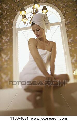 Stock Image - people, woman, towel, bath, bathing, indoors, Caucasian. Fotosearch