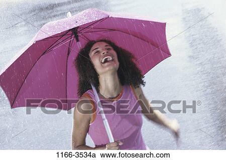 people, woman, umbrella, rain, Hispanic, rainy View Large Photo Image Stock Image - people, woman, umbrella, rain, Hispanic, rainy. Fotosearch