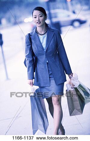 people, woman, walking, Asian, outdoors, carrying, shopping View Large Photo Image Stock Photo - people, woman, walking, Asian, outdoors, carrying, shopping. Fotosearch
