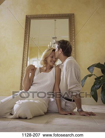 plant, people, home, smiling, new, couple, sitting View Large Photo Image Stock Photo - plant, people, home, smiling, new, couple, sitting. Fotosearch