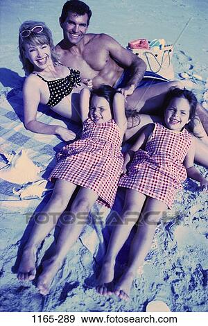 Stock Photo - relaxed, overhead, people, smiling, sun, beach, relaxing. Fotosearch