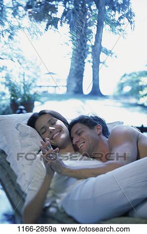 relaxed, people, relaxation, smiling, couple, trees, outdoors View Large Photo Image Stock Image - relaxed, people, relaxation, smiling, couple, trees, outdoors. Fotosearch