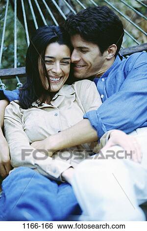 relaxed, people, smiling, couple, hammock, romantic, hugging View Large Photo Image Stock Photograph - relaxed, people, smiling, couple, hammock, romantic, hugging. Fotosearch