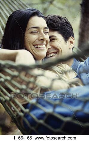 relaxed, people, smiling, couple, Hispanic, hammock, flirting View Large Photo Image Stock Photography - relaxed, people, smiling, couple, Hispanic, hammock, flirting. Fotosearch