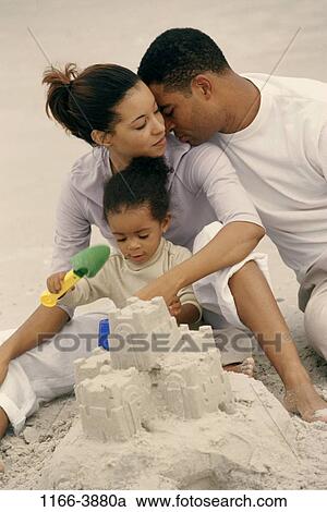sand, people, building, beach, serious, family, affection View Large Photo Image Stock Image - sand, people, building, beach, serious, family, affection. Fotosearch