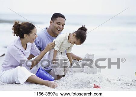 sand, people, building, playing, beach, family, play View Large Photo Image Stock Image - sand, people, building, playing, beach, family, play. Fotosearch