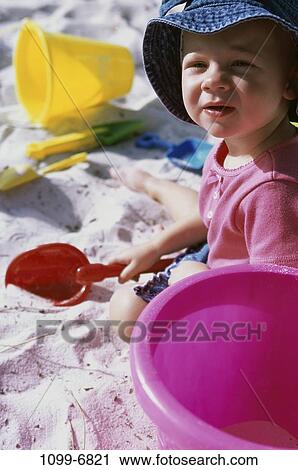 sand, people, playing, hat, girl, playground, shovel View Large Photo Image Stock Image - sand, people, playing, hat, girl, playground, shovel. Fotosearch