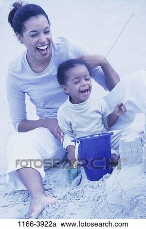 sand, people, playing, mother, beach, family, digging View Large Photo Image Stock Image - sand, people, playing, mother, beach, family, digging. Fotosearch